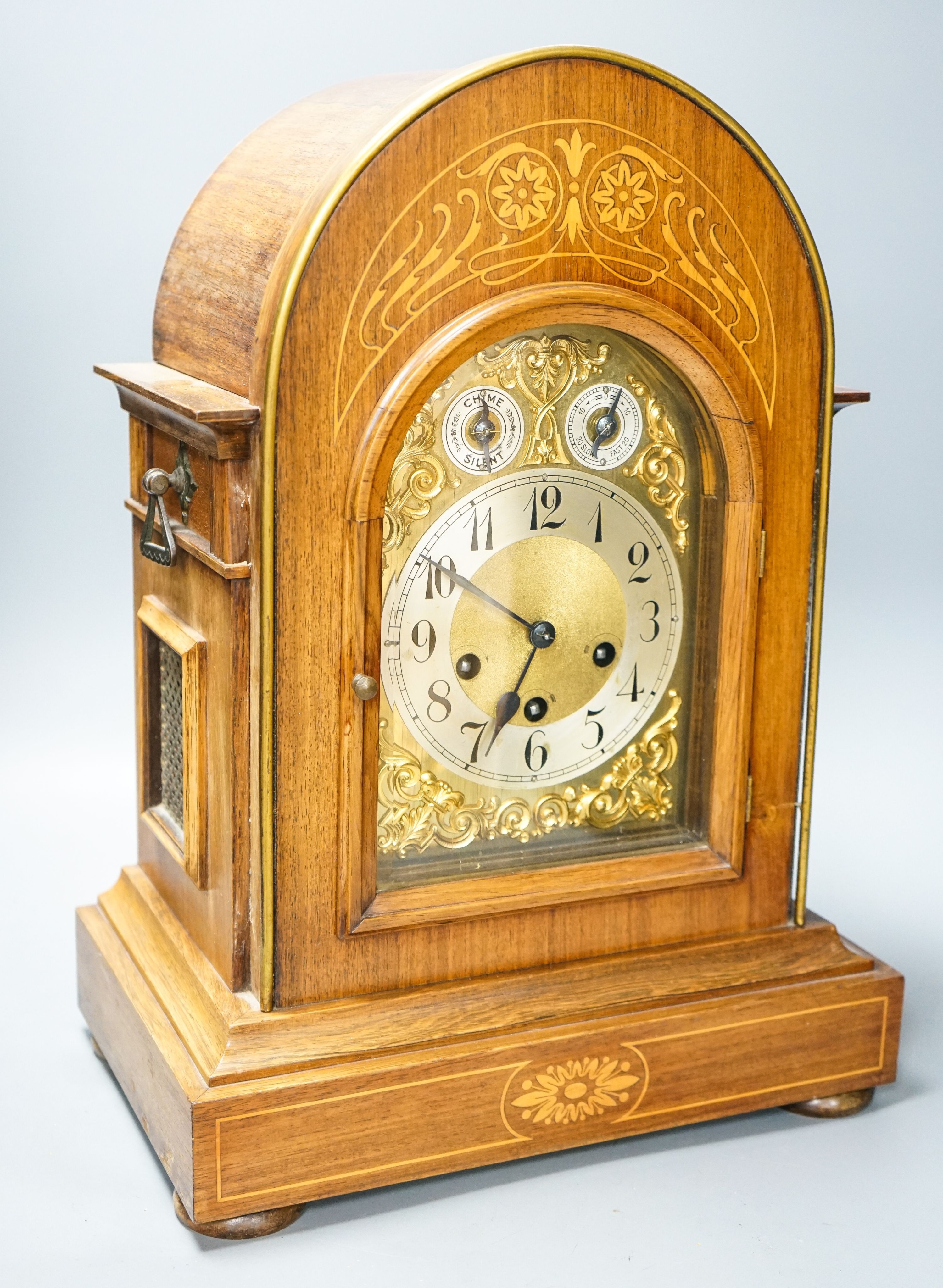 A German rosewood and marquetry chiming mantel clock, early 20th century, 45cm